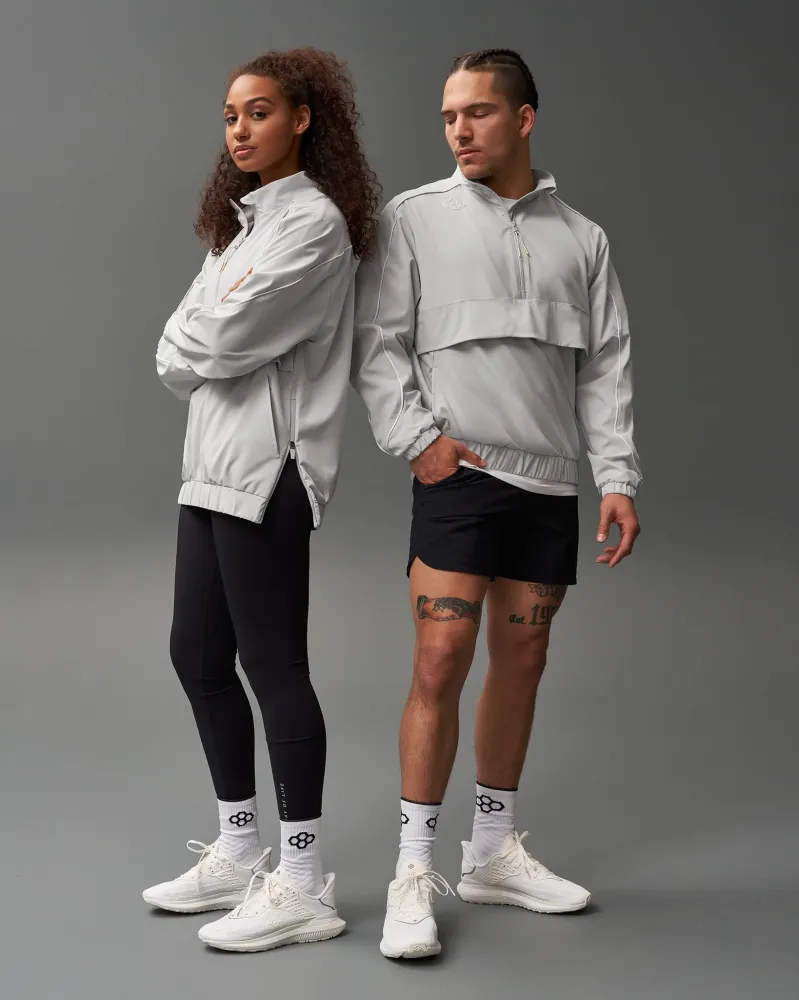 Coupe-vent 1/4 zip RUDIS - Gris lunaire avec système antivol