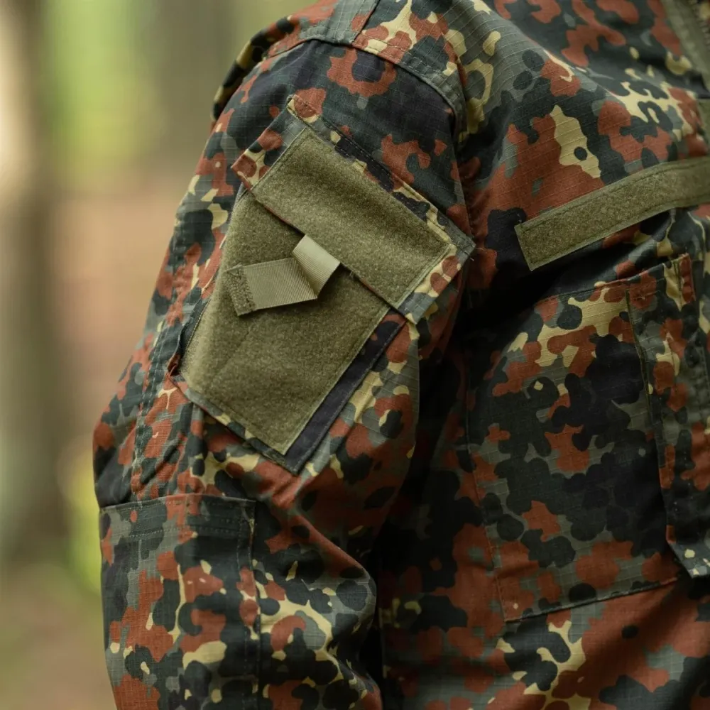 Filet de sécurité Veste de style militaire américain de marque MFH, uniforme de terrain, camouflage flecktarn, ripstop, NEUF